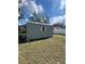 Exterior of backyard storage shed with small window at 22065 Malone Ave, Port Charlotte, FL 33952