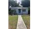 Charming bungalow with landscaped lawn and walkway at 2421 19Th S St, St Petersburg, FL 33712