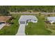 House with gray roof, driveway and green lawn, seen from above at 25434 Alicante Dr, Punta Gorda, FL 33955