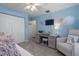 Bedroom with a desk and seating area, ideal as an office or guest room at 2824 Countryside Blvd # 326, Clearwater, FL 33761