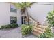 Condo entrance with stairs and landscaping at 2824 Countryside Blvd # 326, Clearwater, FL 33761