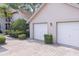 Two-car garage with paver driveway at 2824 Countryside Blvd # 326, Clearwater, FL 33761