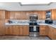 Updated kitchen with light wood cabinets and granite counters at 2824 Countryside Blvd # 326, Clearwater, FL 33761