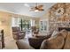 Comfortable living room with stone fireplace and high ceilings at 2824 Countryside Blvd # 326, Clearwater, FL 33761