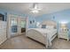 Bright main bedroom with king-size bed and access to a private balcony at 2824 Countryside Blvd # 326, Clearwater, FL 33761