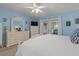 Main bedroom with a dresser and king-size bed, offering plenty of space at 2824 Countryside Blvd # 326, Clearwater, FL 33761