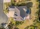 Bird's-eye view of a home with a pool and a metal roof at 288 Mobbly Bay Dr, Oldsmar, FL 34677