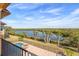 Balcony with scenic water views and lush landscape at 288 Mobbly Bay Dr, Oldsmar, FL 34677