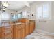 Bathroom with double vanity, a large shower, and a soaking tub at 288 Mobbly Bay Dr, Oldsmar, FL 34677