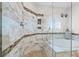 Bathroom with a walk-in shower and a soaking tub at 288 Mobbly Bay Dr, Oldsmar, FL 34677