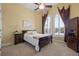 Comfortable bedroom with a double bed and wood furniture at 288 Mobbly Bay Dr, Oldsmar, FL 34677