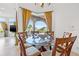 Casual breakfast nook with glass table and lake view at 288 Mobbly Bay Dr, Oldsmar, FL 34677