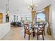 Bright dining area with glass table and lake view at 288 Mobbly Bay Dr, Oldsmar, FL 34677