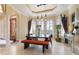 Bright dining room with arched windows and modern furniture at 288 Mobbly Bay Dr, Oldsmar, FL 34677