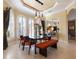 Bright dining room with arched windows and modern furniture at 288 Mobbly Bay Dr, Oldsmar, FL 34677