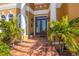 Grand entrance with double doors and tiled steps leading to the home at 288 Mobbly Bay Dr, Oldsmar, FL 34677