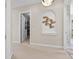 Hallway with walk-in closet and decorative wall art at 288 Mobbly Bay Dr, Oldsmar, FL 34677