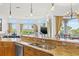 Kitchen with granite countertops and stainless steel sink at 288 Mobbly Bay Dr, Oldsmar, FL 34677