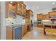 Kitchen with wine cooler and wood cabinetry at 288 Mobbly Bay Dr, Oldsmar, FL 34677