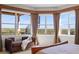 Bedroom with expansive windows and scenic views at 288 Mobbly Bay Dr, Oldsmar, FL 34677