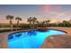 Inviting kidney-shaped pool with spa, surrounded by pavers at 288 Mobbly Bay Dr, Oldsmar, FL 34677