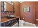 Stylish powder room with decorative sink and art at 288 Mobbly Bay Dr, Oldsmar, FL 34677