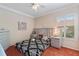 Bedroom with a ceiling fan, window with shutters, orange carpet, and a gray upholstered headboard at 2987 Wentworth Way, Tarpon Springs, FL 34688