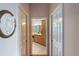 Hallway view of the bathroom, showing double doors leading into the neutral-toned bathroom at 2987 Wentworth Way, Tarpon Springs, FL 34688