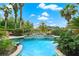 Resort-style pool and spa area, surrounded by lush landscaping and tranquil views at 2987 Wentworth Way, Tarpon Springs, FL 34688