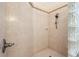 Walk-in shower with glass block and tile surround at 2987 Wentworth Way, Tarpon Springs, FL 34688