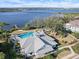 Aerial view of community pool, clubhouse, and waterfront access at 3010 Palm Key Ave, Oldsmar, FL 34677