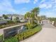 Gated community entrance with landscaping and signage for Bayside Terrace at 3010 Palm Key Ave, Oldsmar, FL 34677