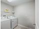 Well-lit laundry room with washer and dryer included at 3010 Palm Key Ave, Oldsmar, FL 34677