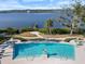 Relaxing community pool with water feature and waterfront views at 3010 Palm Key Ave, Oldsmar, FL 34677