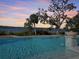 Luxury pool with sunset view overlooking the water at 3010 Palm Key Ave, Oldsmar, FL 34677