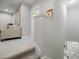 Upstairs hallway with beige carpet and built-in shelving at 3010 Palm Key Ave, Oldsmar, FL 34677