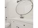 Updated bathroom with white vanity, oval mirror, and modern fixtures at 3034 Burlington N Ave, St Petersburg, FL 33713