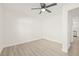 Bright bedroom featuring light gray vinyl flooring and ceiling fan at 3034 Burlington N Ave, St Petersburg, FL 33713