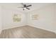 Second bedroom with ceiling fan and hardwood floors at 3034 Burlington N Ave, St Petersburg, FL 33713