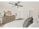 Bedroom with ceiling fan, dresser, and window with natural light at 3034 Burlington N Ave, St Petersburg, FL 33713