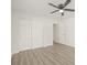 Bedroom with hardwood floors, ceiling fan and sliding door closet at 3034 Burlington N Ave, St Petersburg, FL 33713