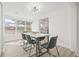 Bright dining room with large windows, a marble top table, and gray chairs at 3034 Burlington N Ave, St Petersburg, FL 33713