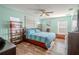 Spacious bedroom with wood flooring and light teal walls at 310 Shirley Dr, Largo, FL 33770