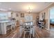 Bright dining room with hardwood floors and chandelier at 310 Shirley Dr, Largo, FL 33770