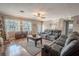 Living room with hardwood floors, comfortable seating, and a large window at 310 Shirley Dr, Largo, FL 33770