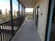 A spacious screened balcony offering great views of the neighborhood at 3300 Cove Cay Dr # 6G, Clearwater, FL 33760