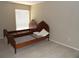 Bedroom with carpet, single window, and antique style bed frame at 3300 Cove Cay Dr # 6G, Clearwater, FL 33760