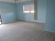 Bedroom with light blue walls and carpeted floors at 3300 Cove Cay Dr # 6G, Clearwater, FL 33760