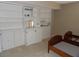 Bedroom featuring carpet and built in shelving and cabinets at 3300 Cove Cay Dr # 6G, Clearwater, FL 33760