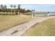 Scenic golf course view with a bridge over a water hazard, offering a challenging yet beautiful golfing experience at 3300 Cove Cay Dr # 6G, Clearwater, FL 33760